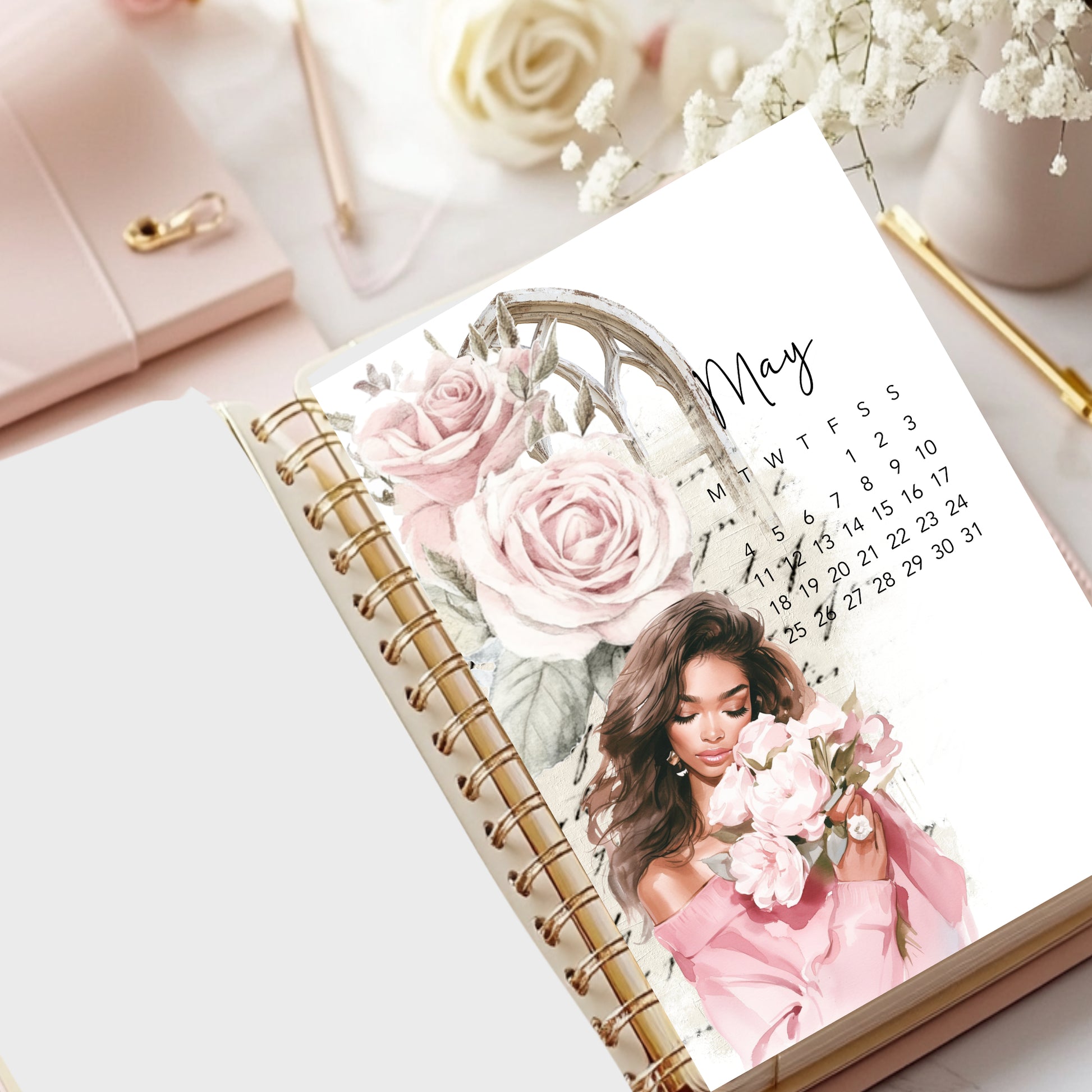 May 2026Calendar with floral design and a woman holding flowers on a desk with a pink handbag and white roses.