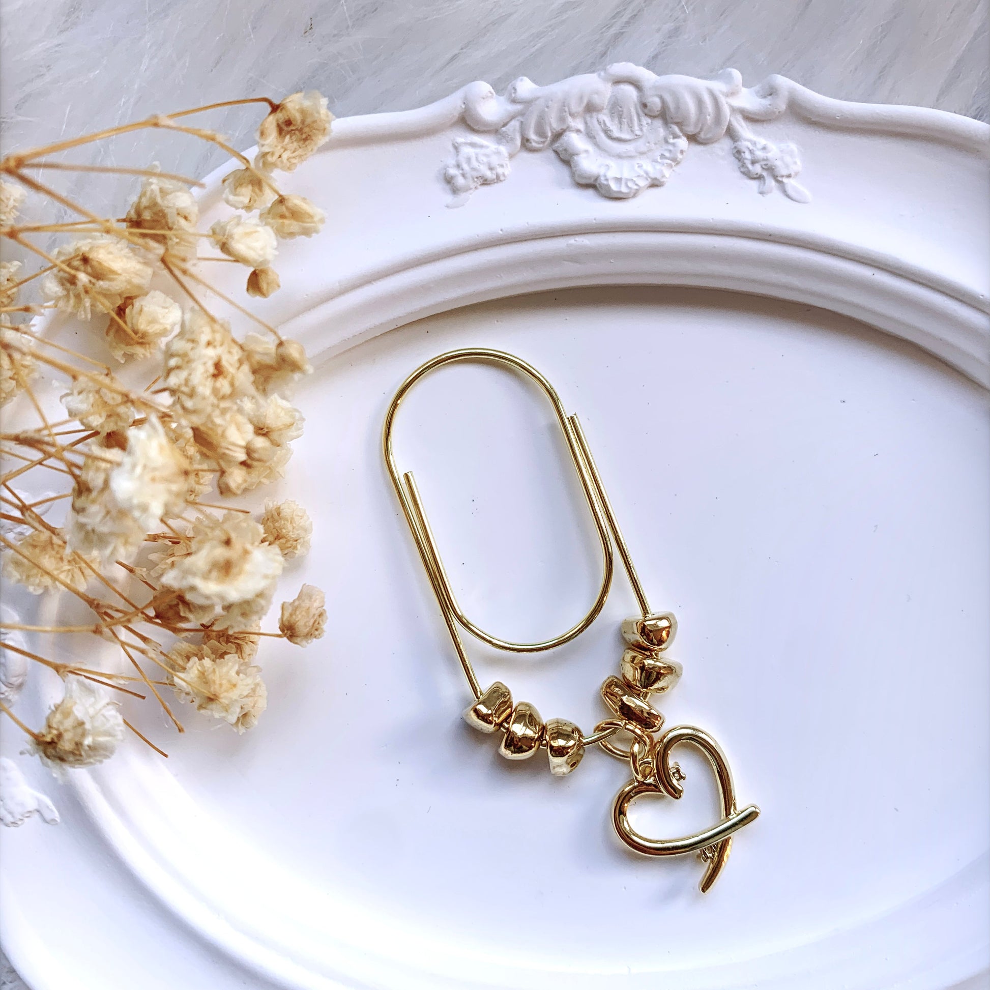 Irregularly shaped hematite gold beads with heart charm